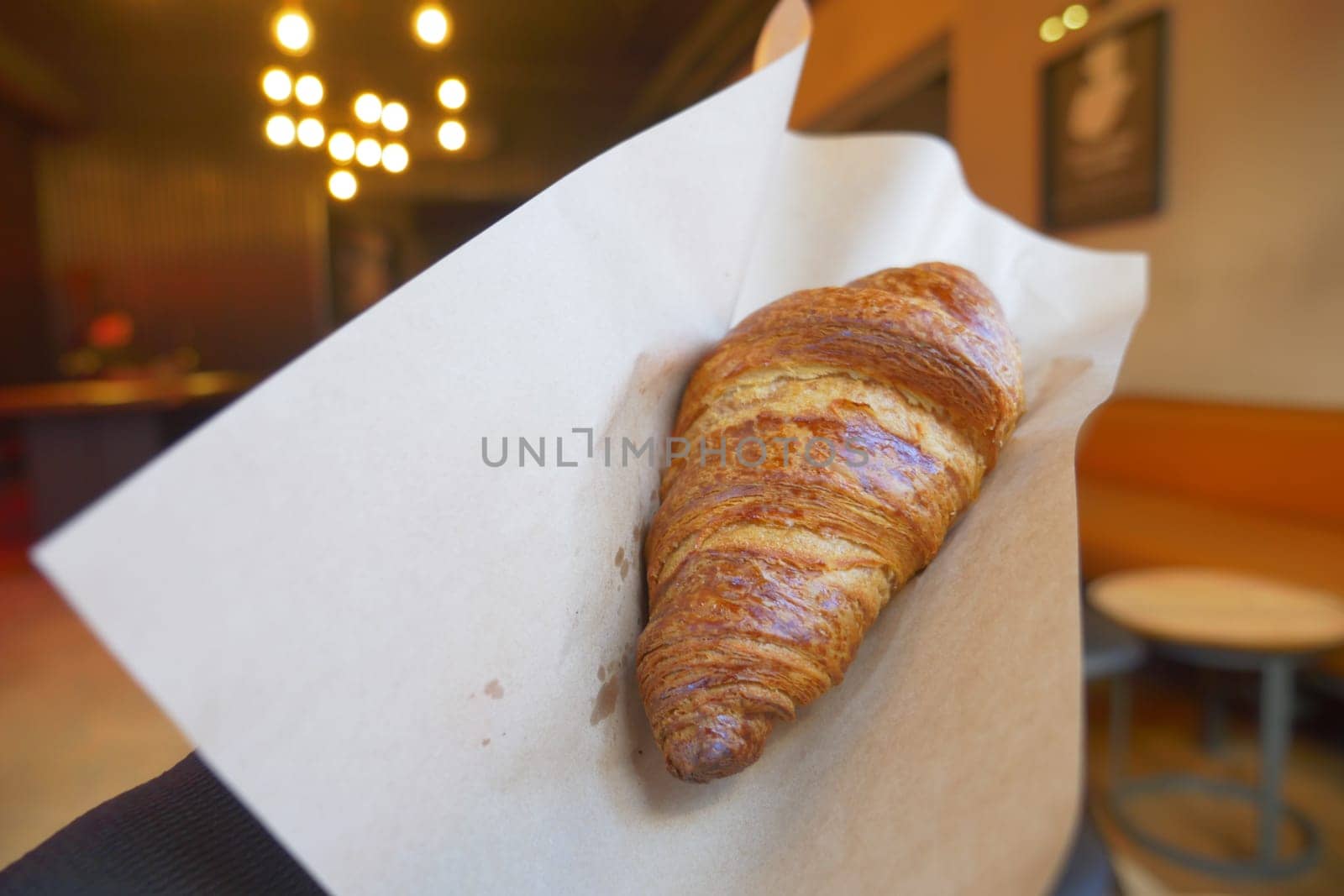 top view of hand pick fresh baked croissant .