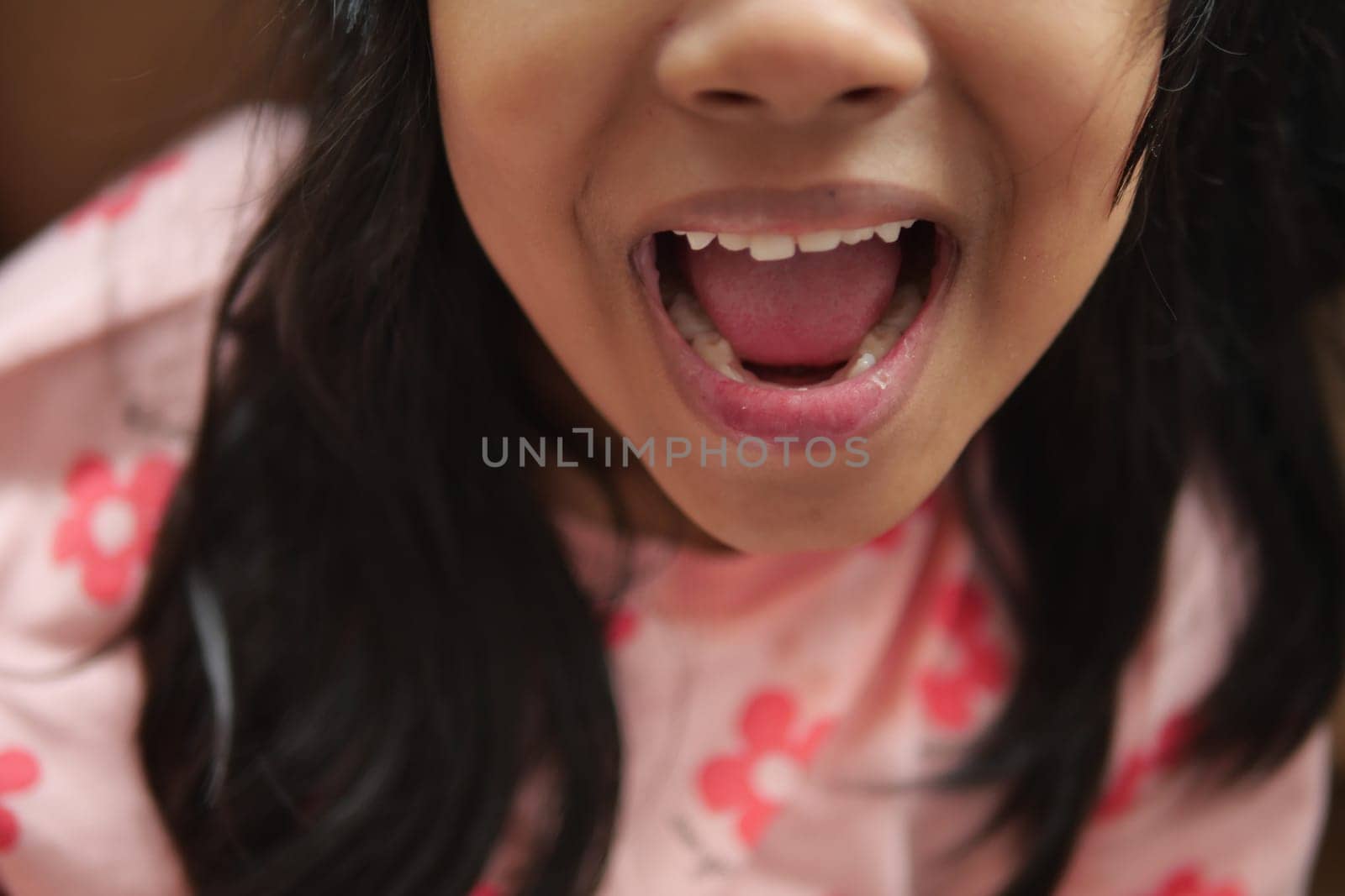 close up of child screaming at home by towfiq007