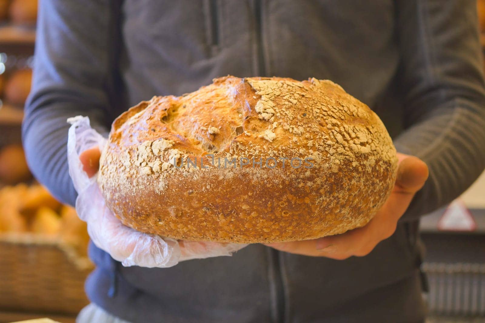 Person holding a loaf of bread Food, Staple food, Baked goods, Fast food,