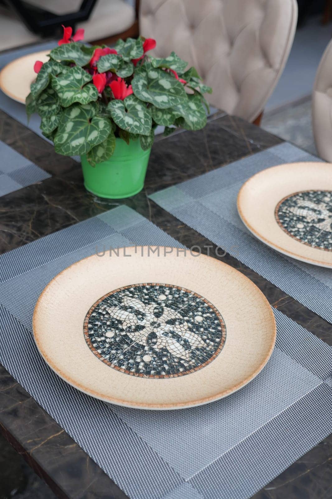 fork, knife and a circle shape plate on table .