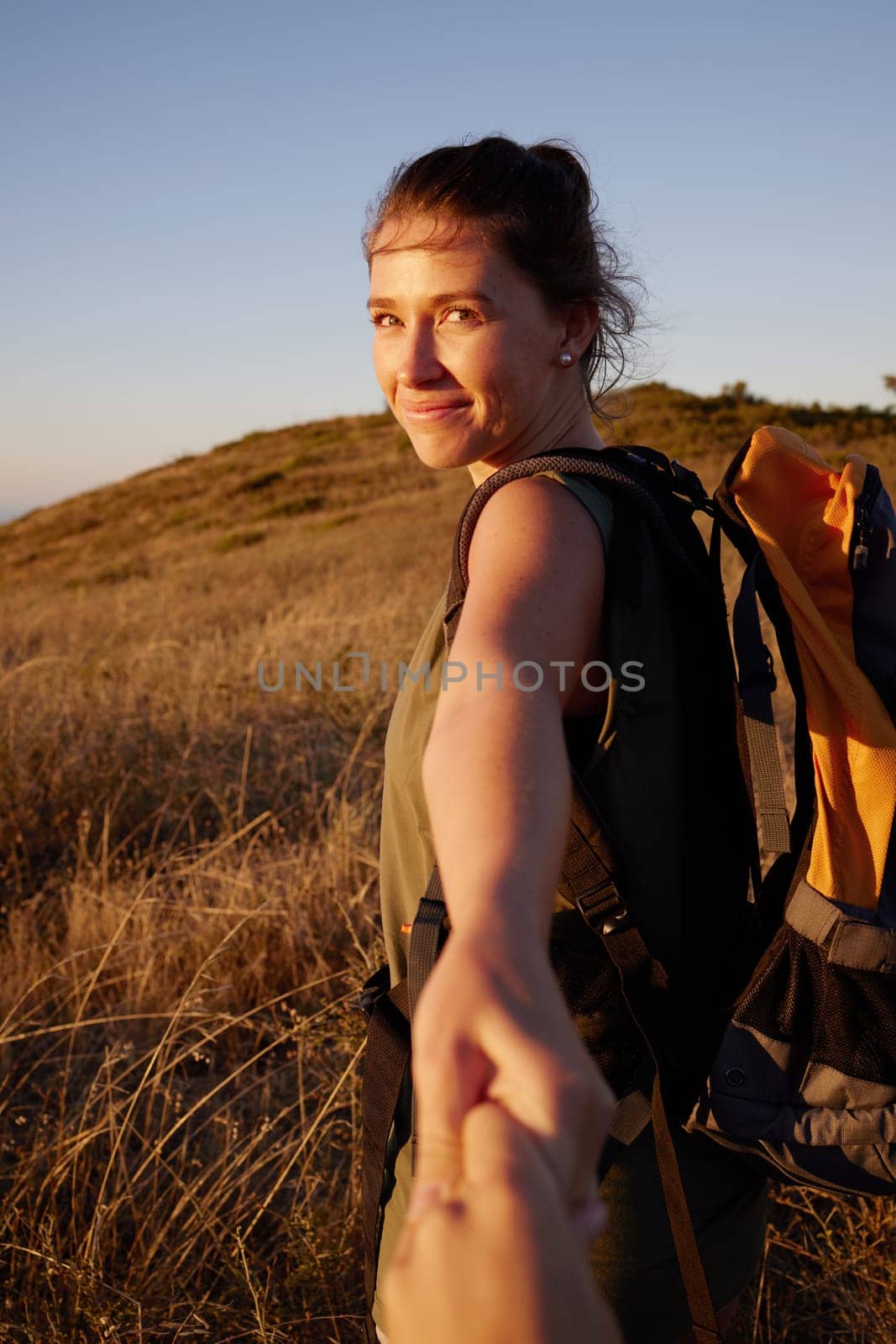 Smile, woman with POV and couple hiking, travel and tourism with exploring nature together for honeymoon. Romantic getaway, exercise for bonding and people on adventure, trekking and holding hands by YuriArcurs