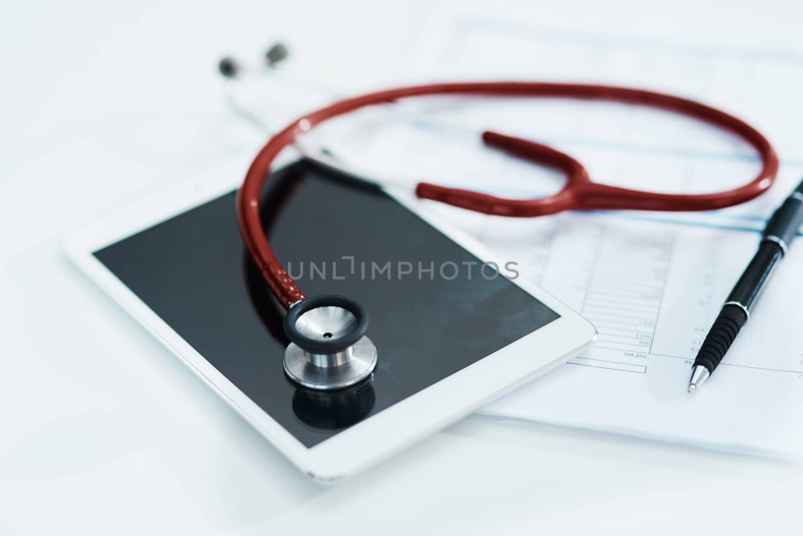 Hospital, documents and tablet with stethoscope on desk for medical website, telehealth and research. Healthcare, cardiology and digital tech, equipment and clipboard for online consulting service.