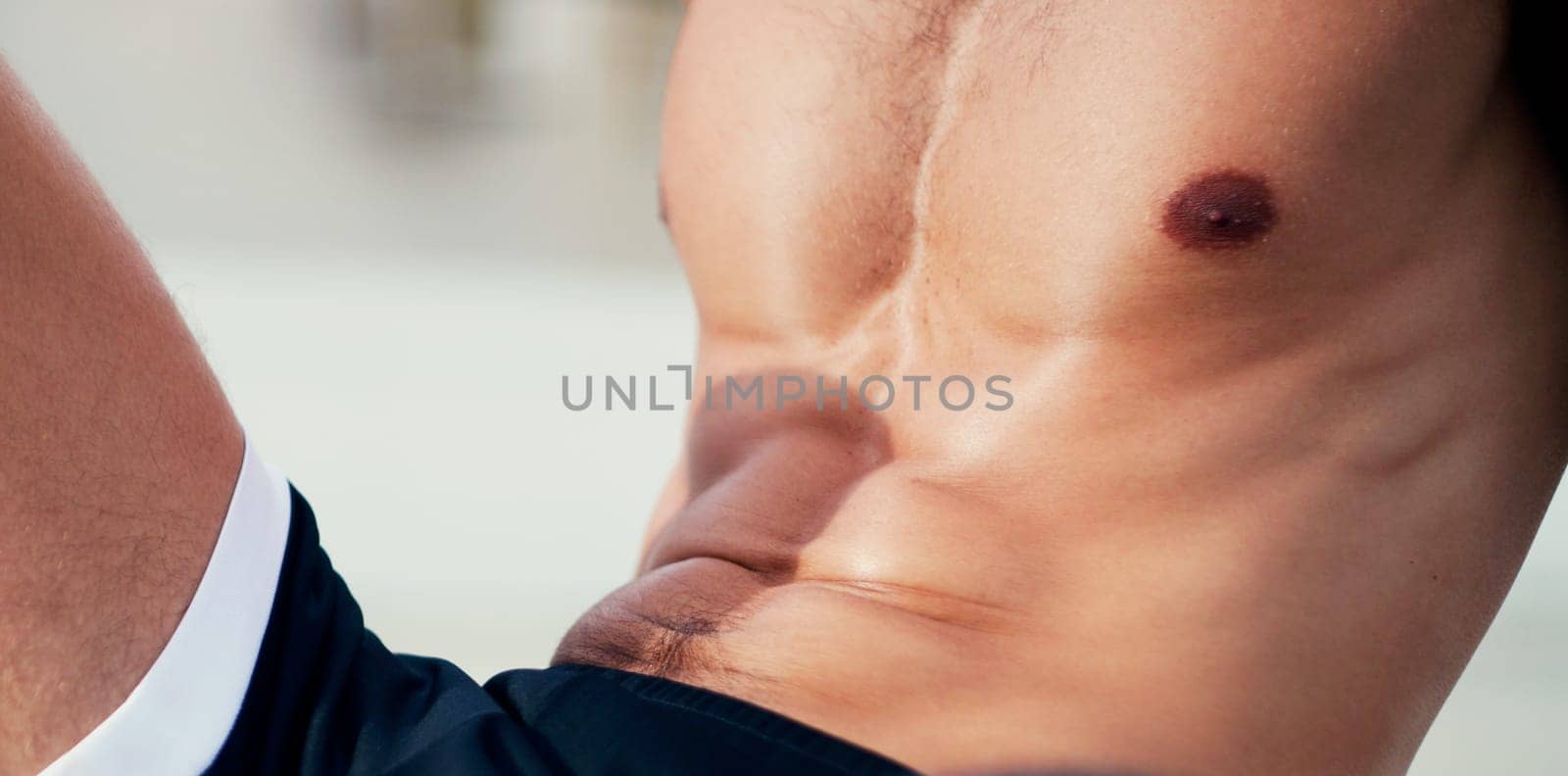 Male athlete, rest and body with abs for sports, exercise and fitness on break in outdoor. Healthy man, topless and workout for cardio, wellness and stomach muscle for strength, training or wellbeing.