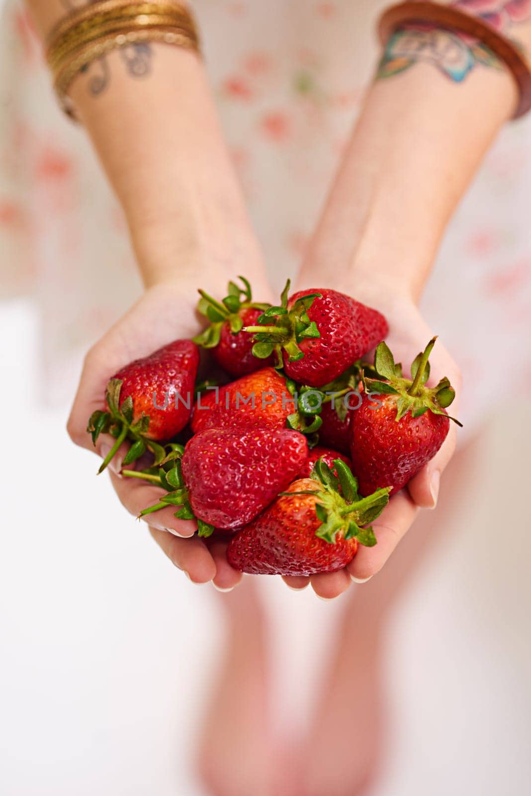 Healthy, strawberry and woman hands with fruit as vegan for protein, organic and balanced diet by eating nutritious snacks. Person, fresh and natural ingredients with vitamin from farming plantation.