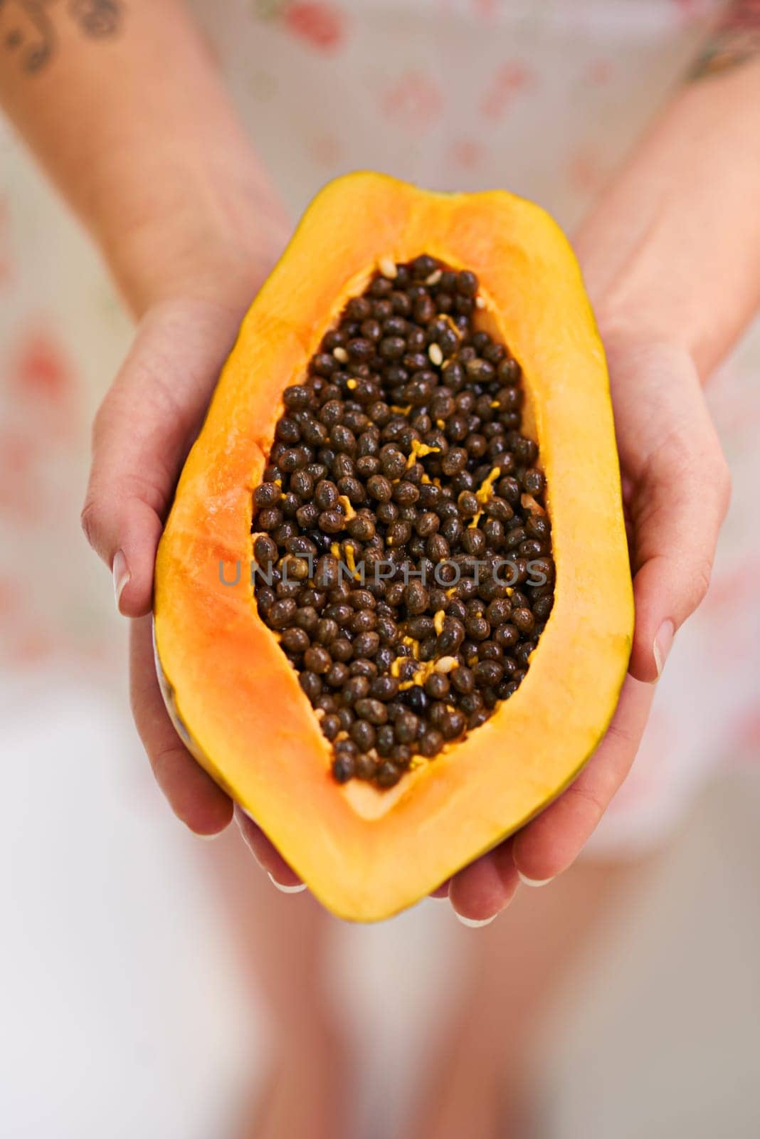 Fruit, papaya and hands in half with seeds for nutrition for healthy eating, nutrients and wellness. Above, pawpaw and diet with snack for weight loss with vitamin c for freshness with balance by YuriArcurs