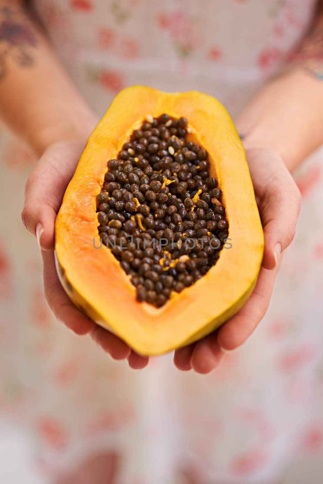 Hands, person and papaya in half with nutrition for healthy eating with seeds, nutrients and wellness. Food, pawpaw and diet with fruit for weight loss with vitamin c for balance with freshness by YuriArcurs