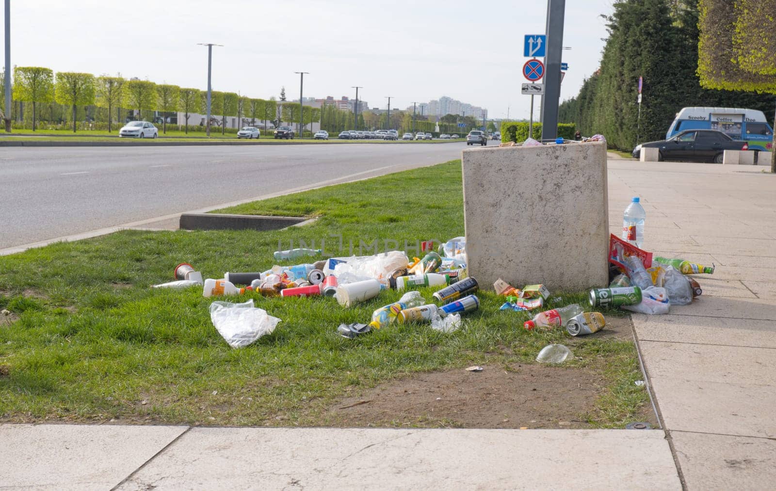 A trash can in a public park and trash around. Krasnodar, Russia. April 20, 2024 by Ekaterina34