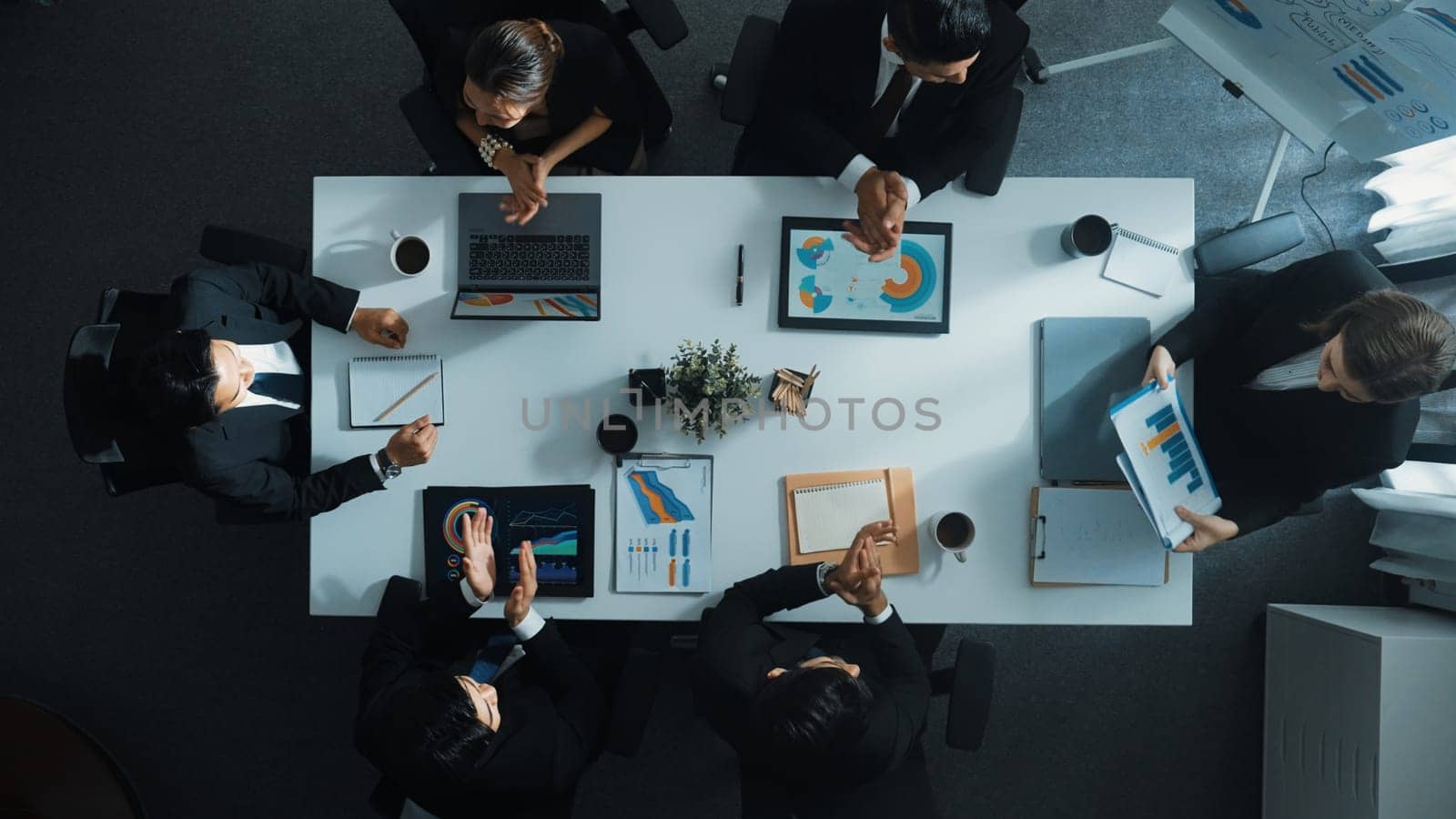 Time lapse of diverse marketing team prepare for business meeting. Top down aerial view of businesspeople placed laptop and tablet with financial statistic at table. Creative business. Directorate.