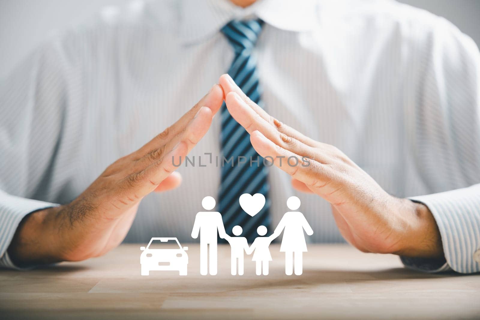 Hands with protective gesture and family by Sorapop