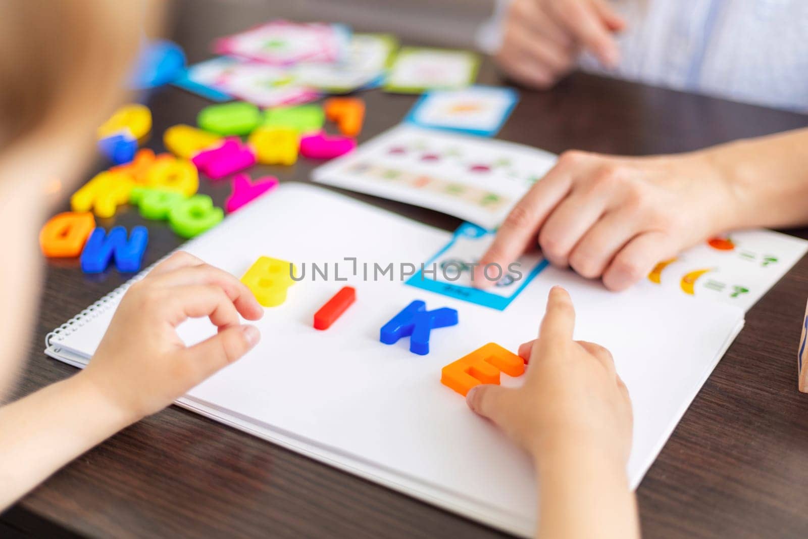 Child Learning Letters with Educational Toys by andreyz