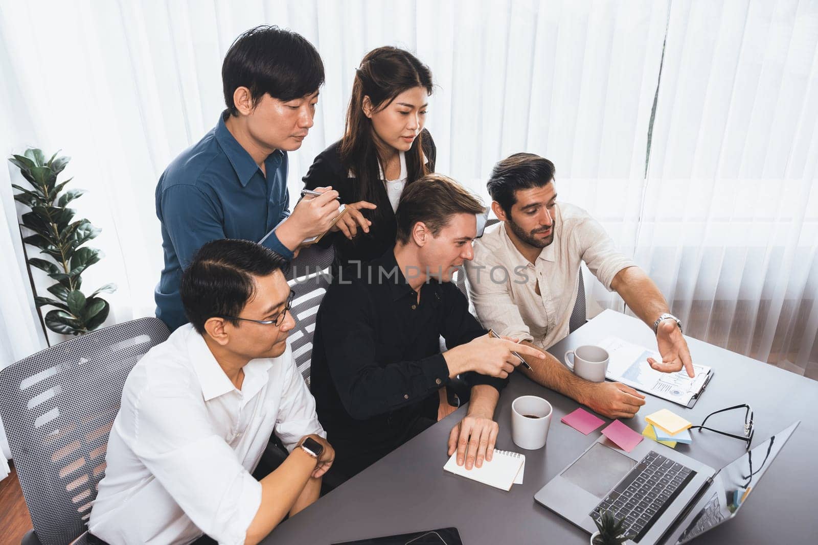 Group of diverse office worker employee working together on strategic business marketing planning in corporate office room. Positive teamwork in business workplace concept. Prudent