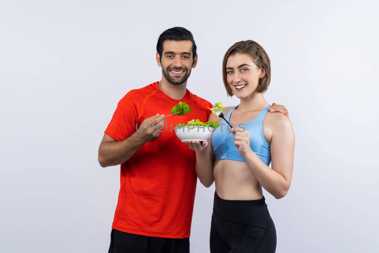 Full body length gaiety shot athletic and sporty young couple with healthy vegan by biancoblue