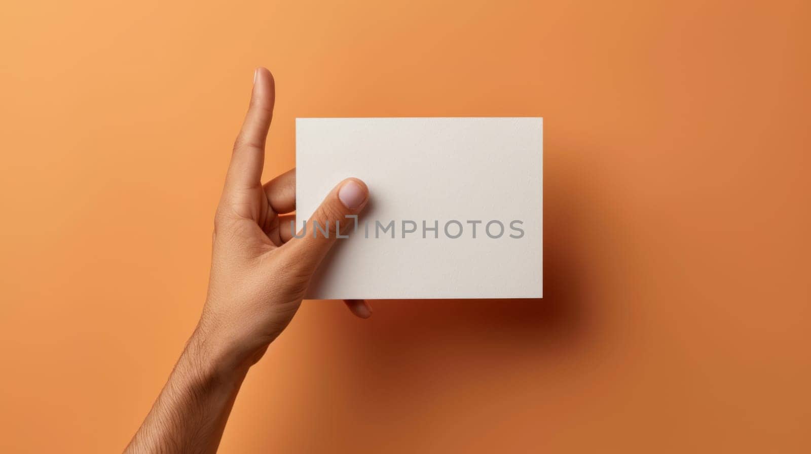 A hand holding a square piece of paper against an orange wall, AI by starush