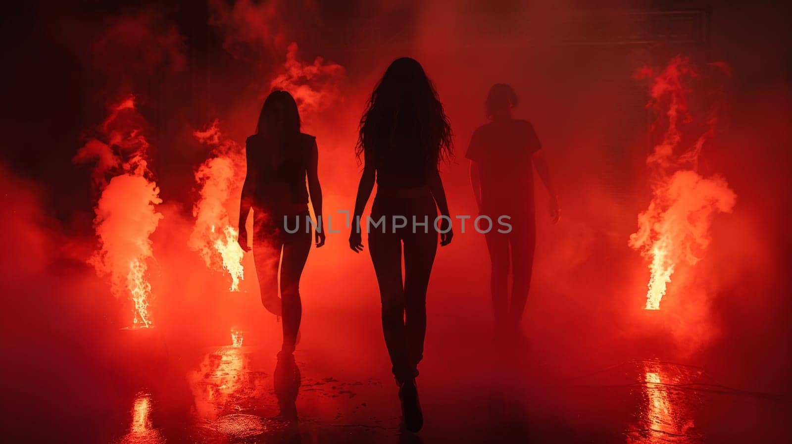 A group of people walking through a fire with smoke