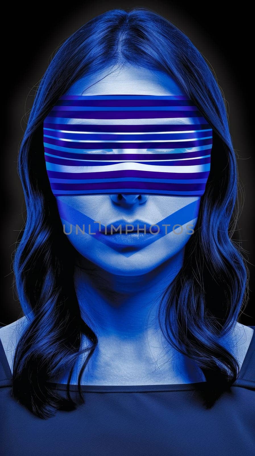 A woman with a blue strip over her eyes and mouth
