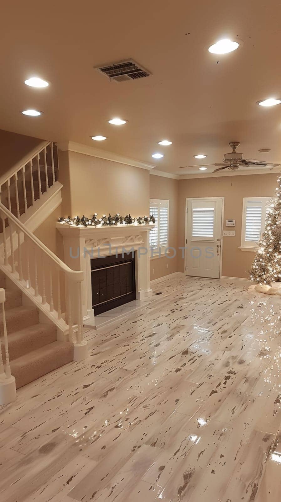 A living room with a fireplace and christmas tree in it