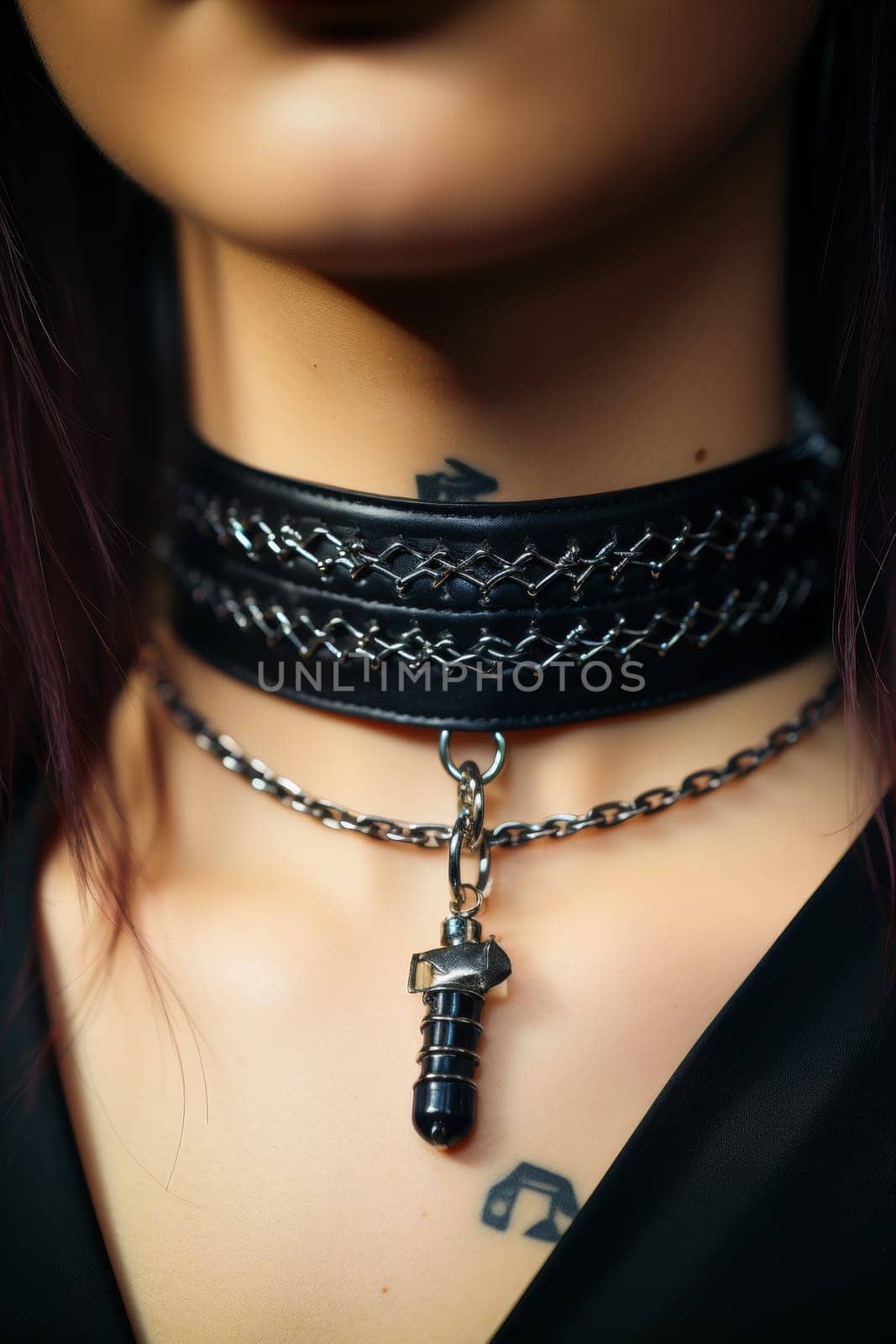 A close up of a woman's neck with an attached choker