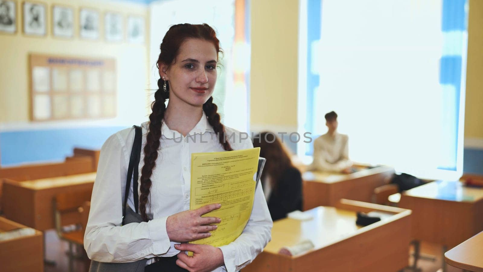 Portrait of a high school girl with notebooks