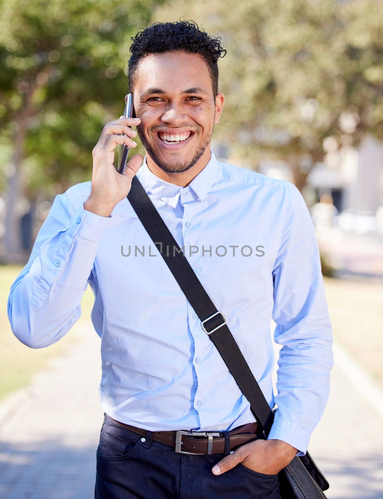 Cellphone, portrait and man in city with phone call for business networking and commute to corporate company. Businessman or entrepreneur, happy and smartphone for communication and professional. by YuriArcurs