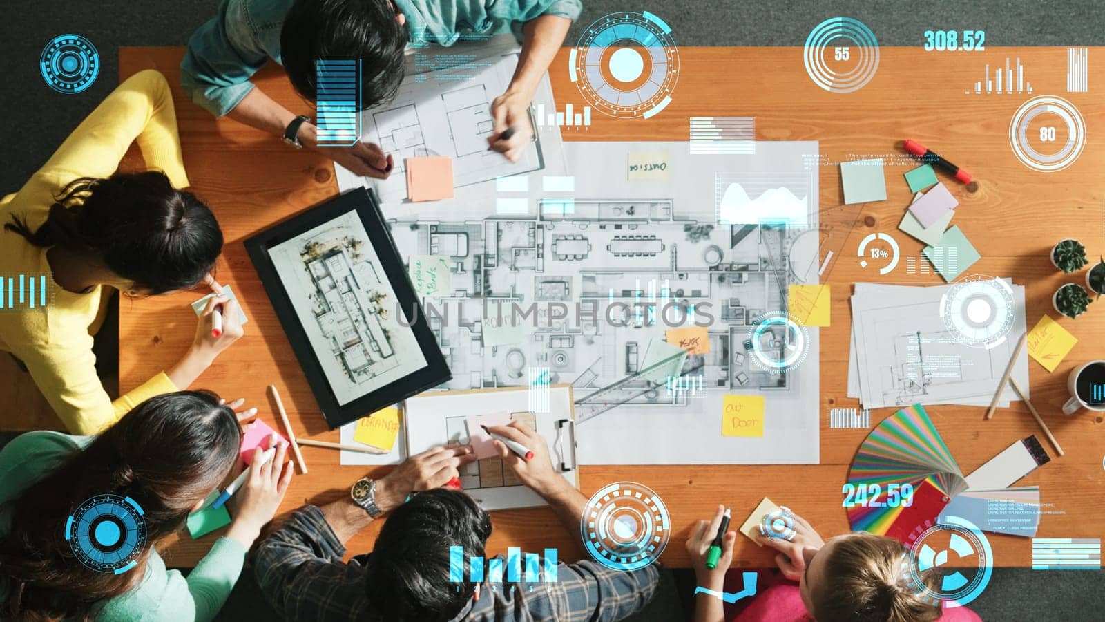 Top down view of business team with casual outfit looking laptop screen and sharing idea. Aerial view of manager works and checking color palette at table with statistic graph holographic. Symposium.