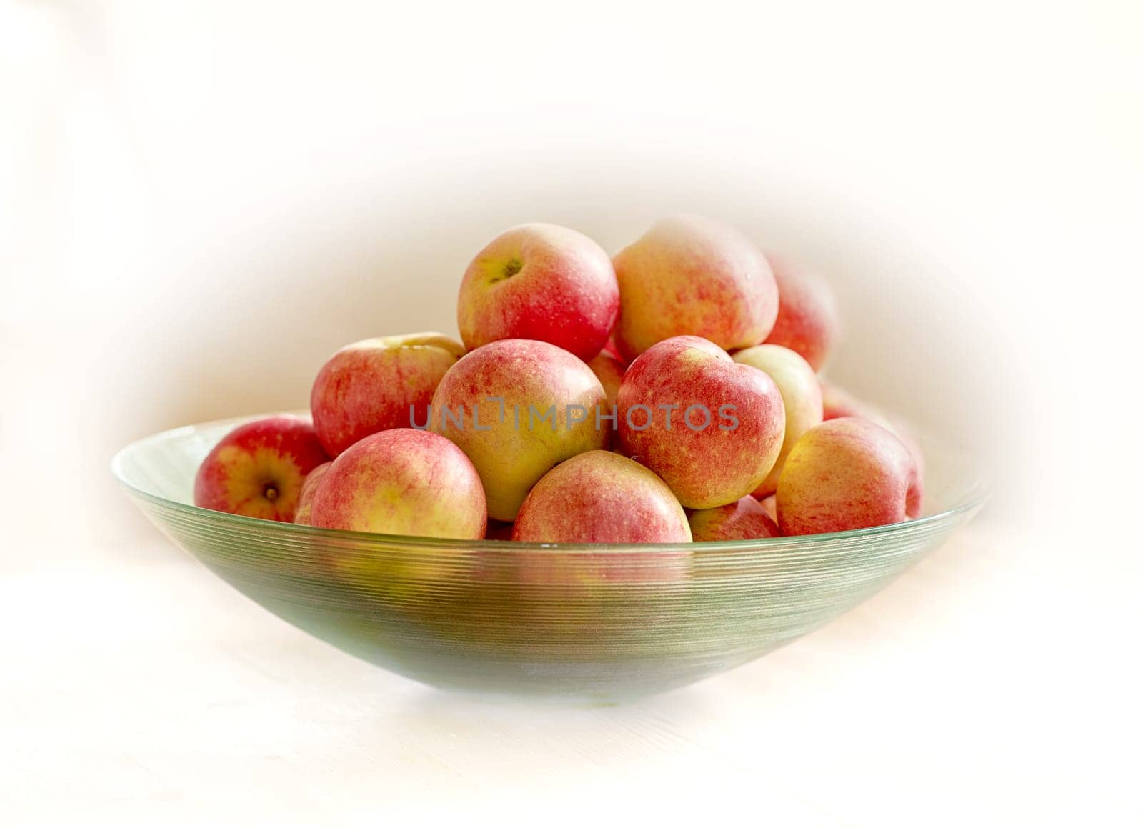 Bowl of red apple, nutrition and snack with health, wellness and organic vitamins and diet. Fruit, plant and harvest with botanical produce, horticulture and vegetation isolated on white background.
