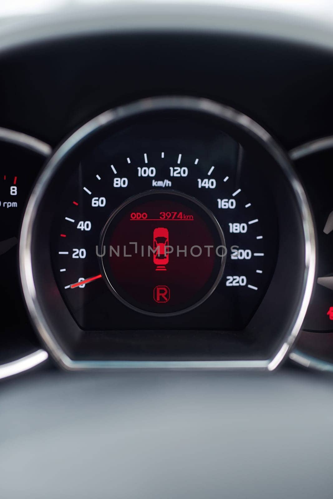 Dashboard, reverse and speedometer of car for information, safety or travel with lights closeup. Automobile, transportation and system display on vehicle interior for drive, journey or road trip.