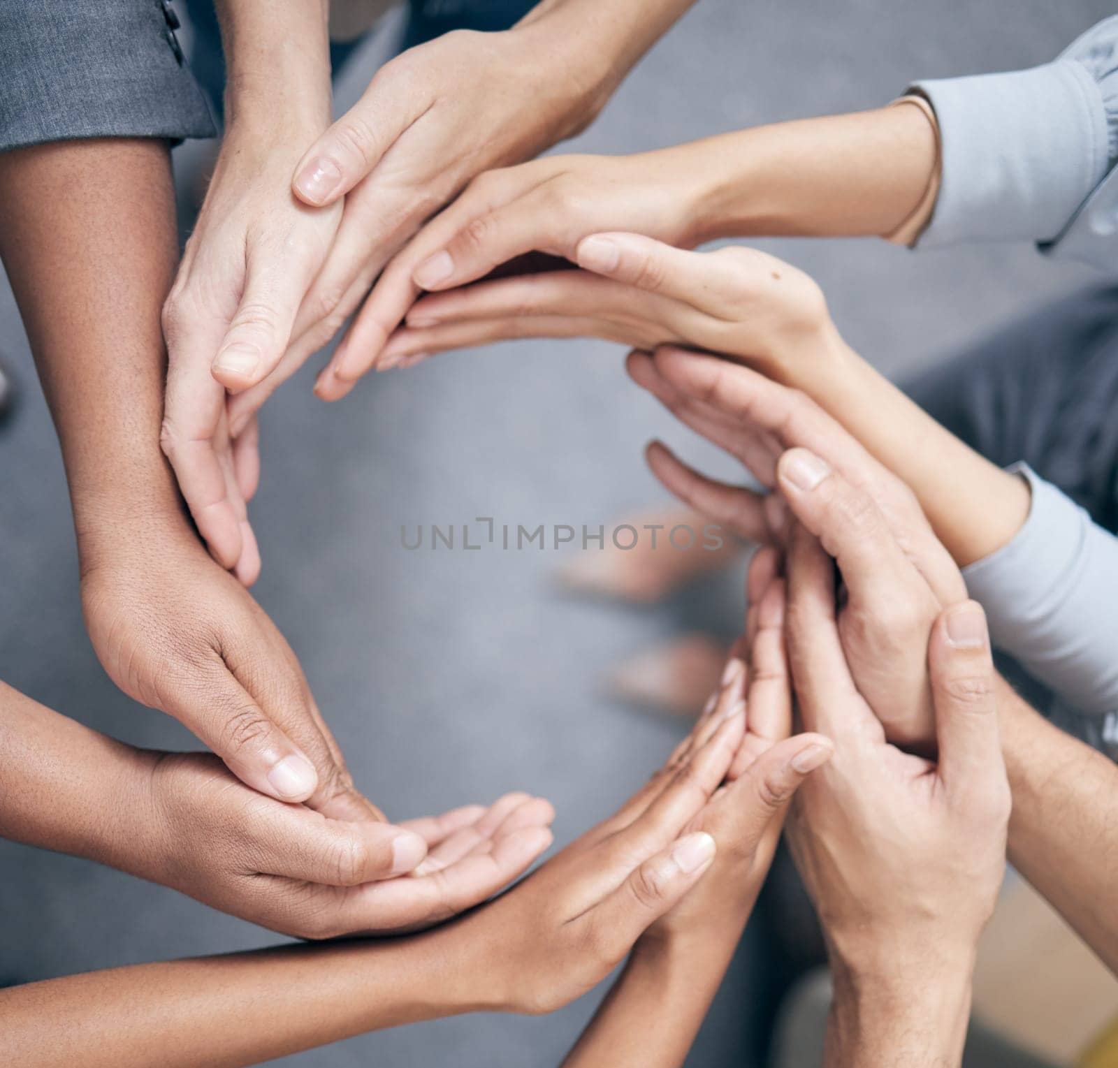 Teamwork, hands and community of diverse people in circle for unity, corporate partnership and hope together. Collaboration, support and equality of employees meeting for vision, growth and goals by YuriArcurs