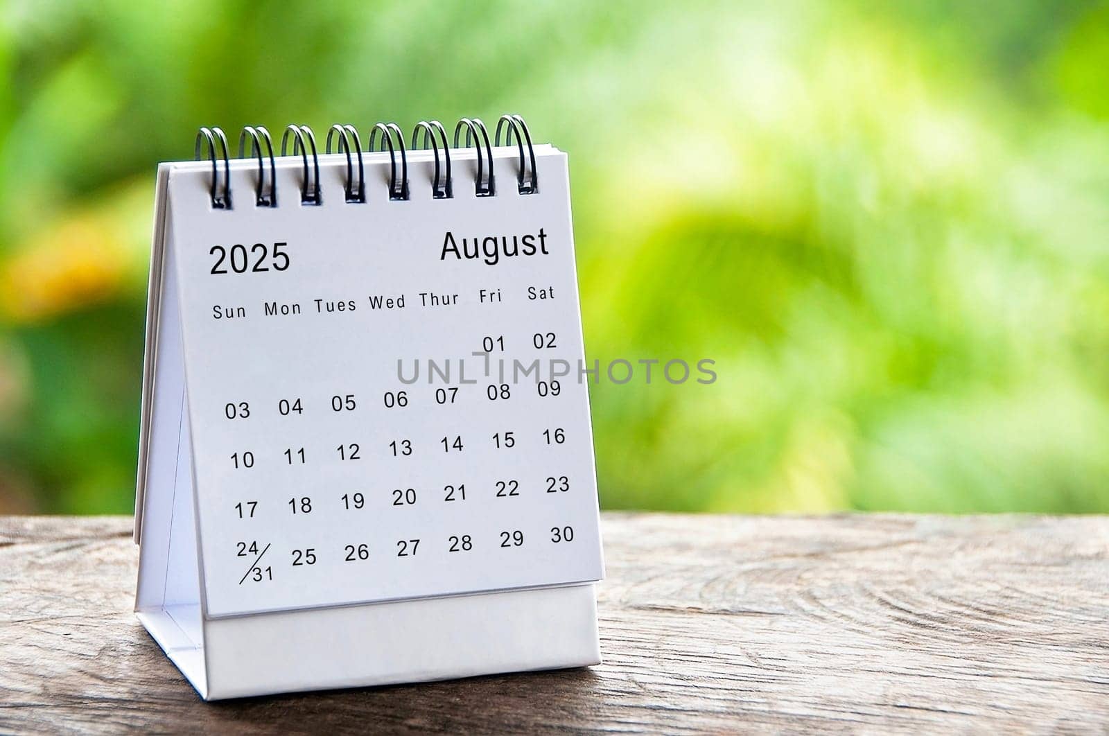 August 2025 white table calendar with customizable space for text. Calendar concept and copy space