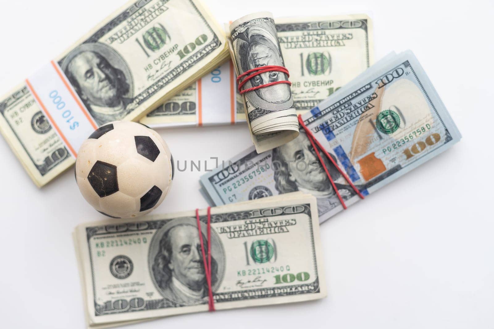 soccer ball over a lot of money. corruption football game. Betting and gambling concept. wold cup. High quality photo