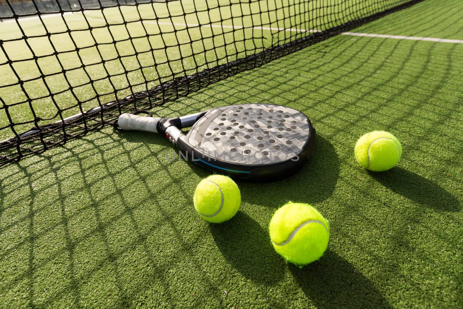 Paddle tennis racket and ball. High quality photo