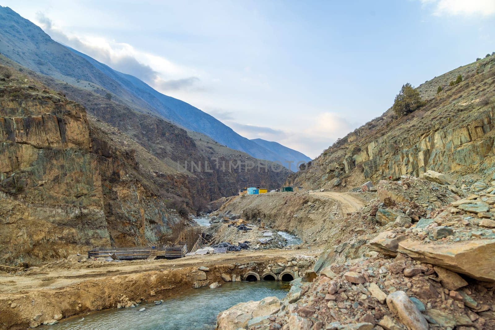 small mountain river hydroelectric plant construction site at spring day by z1b