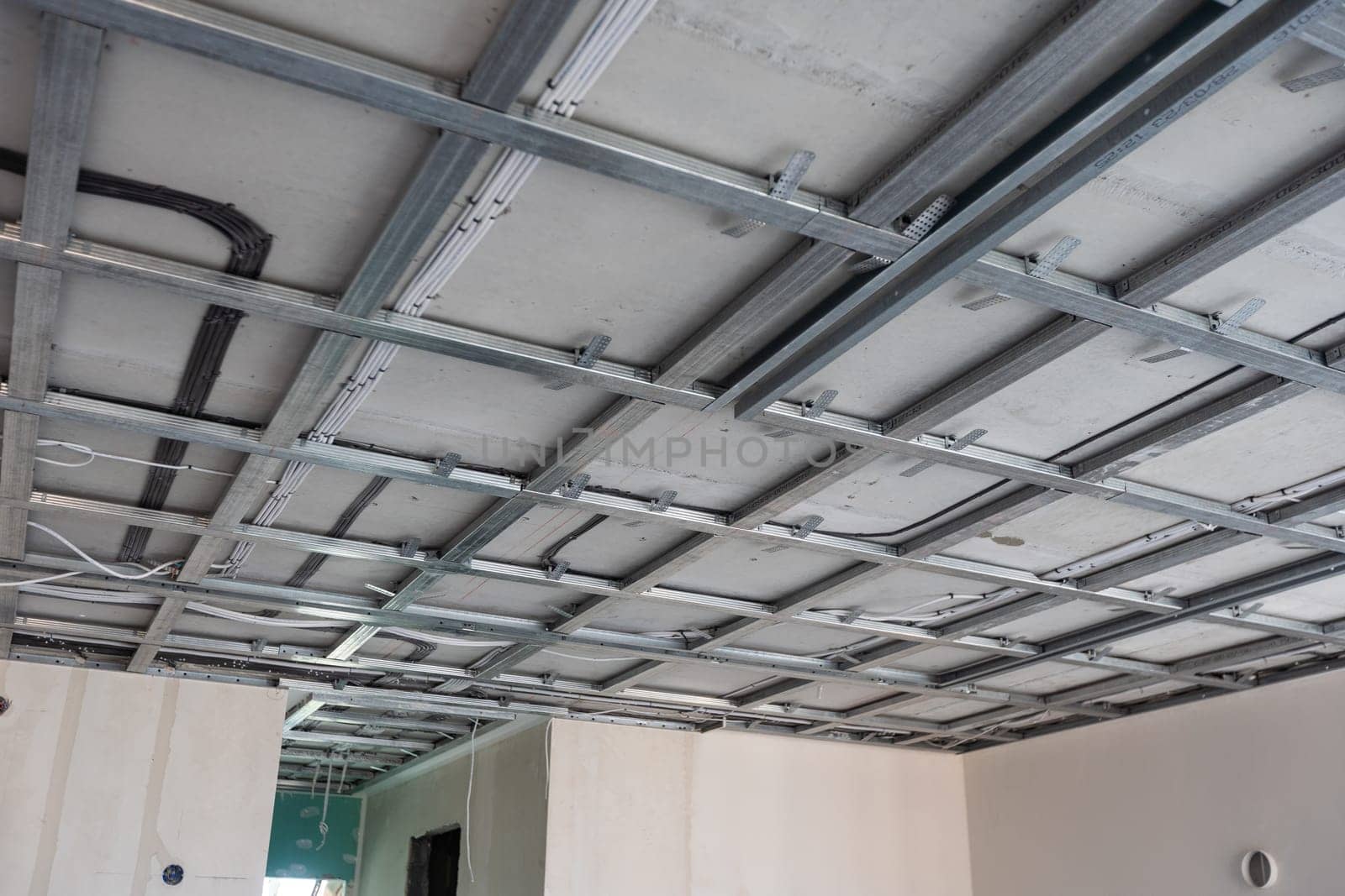 structure of ceiling suspension, installation of gypsum plasterboard and light. High quality photo