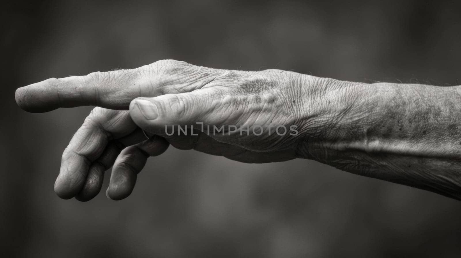 An old man's hand reaching out to touch something