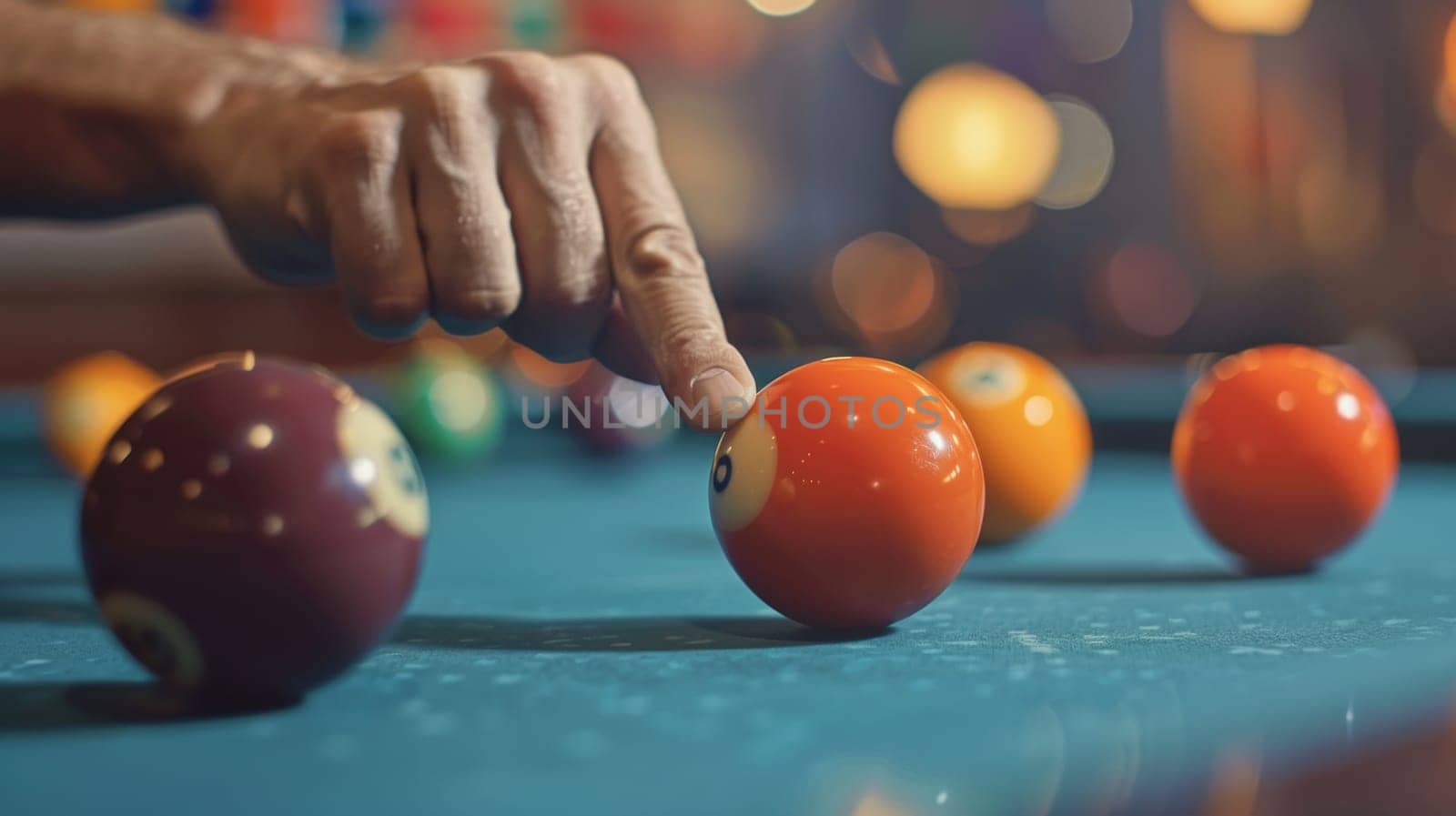 A man is playing pool with a ball on the table