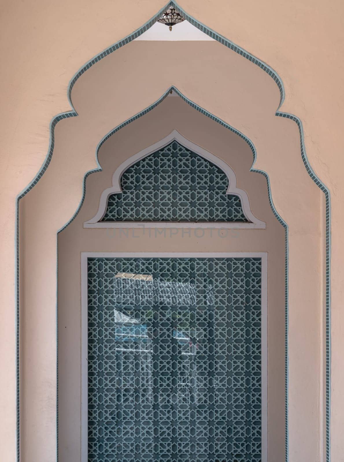 Bangkok, Thailand - Apr 15, 2024 - Interior diminishing perspective view with gable partitions wall inside Bang O mosque leading into glass wall. Mosque architecture and art concept, Space for text, Selective focus.