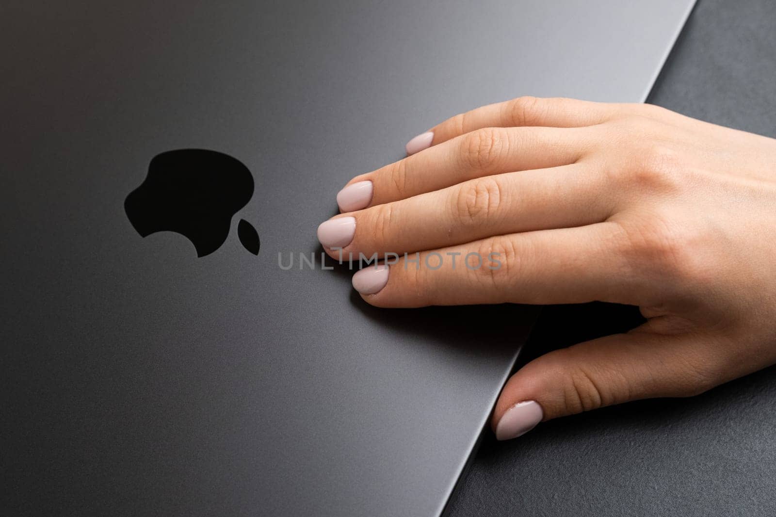 Woman hand opening MacBook to start the work by vladimka