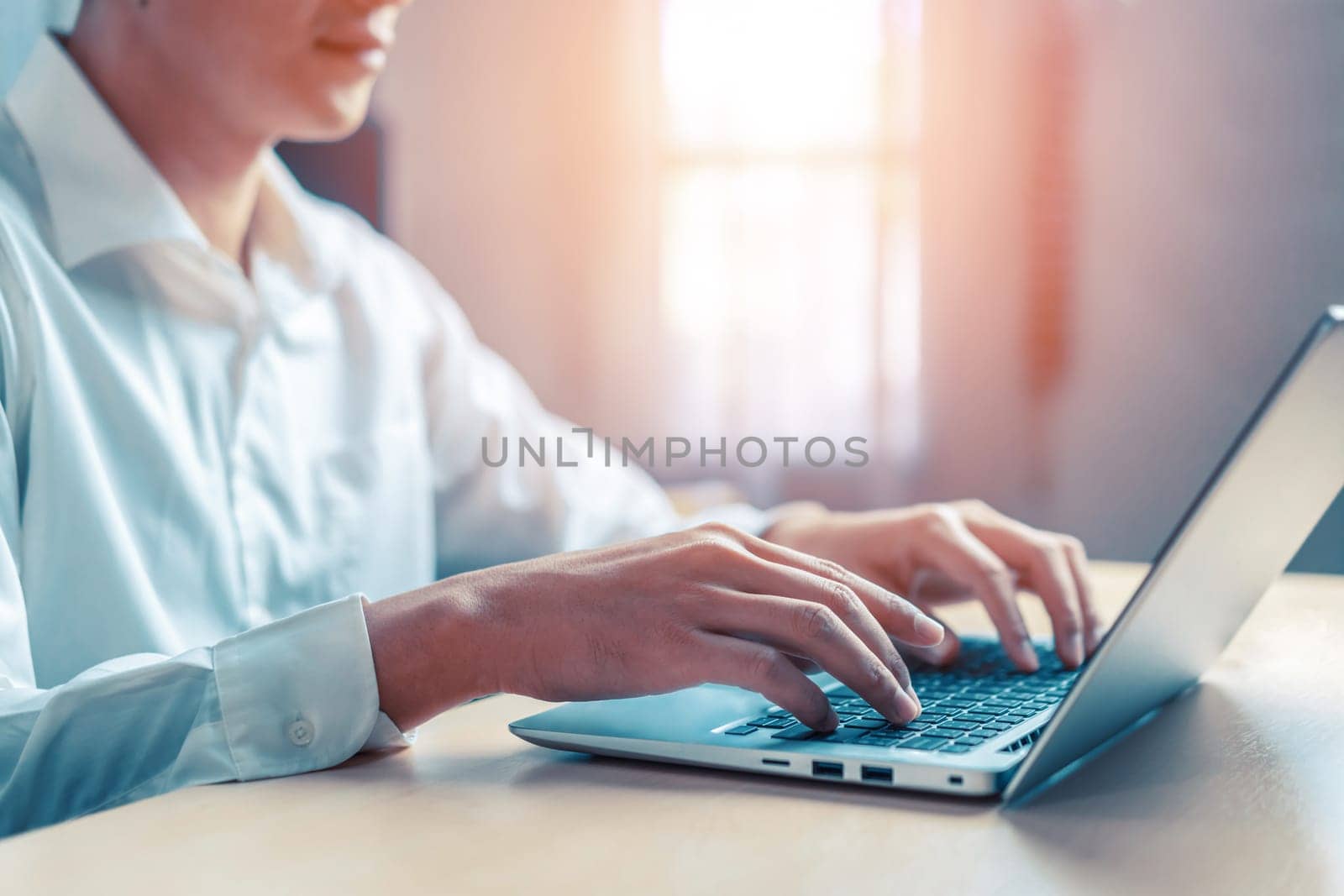 Businessman hand using laptop computer in office. uds by biancoblue