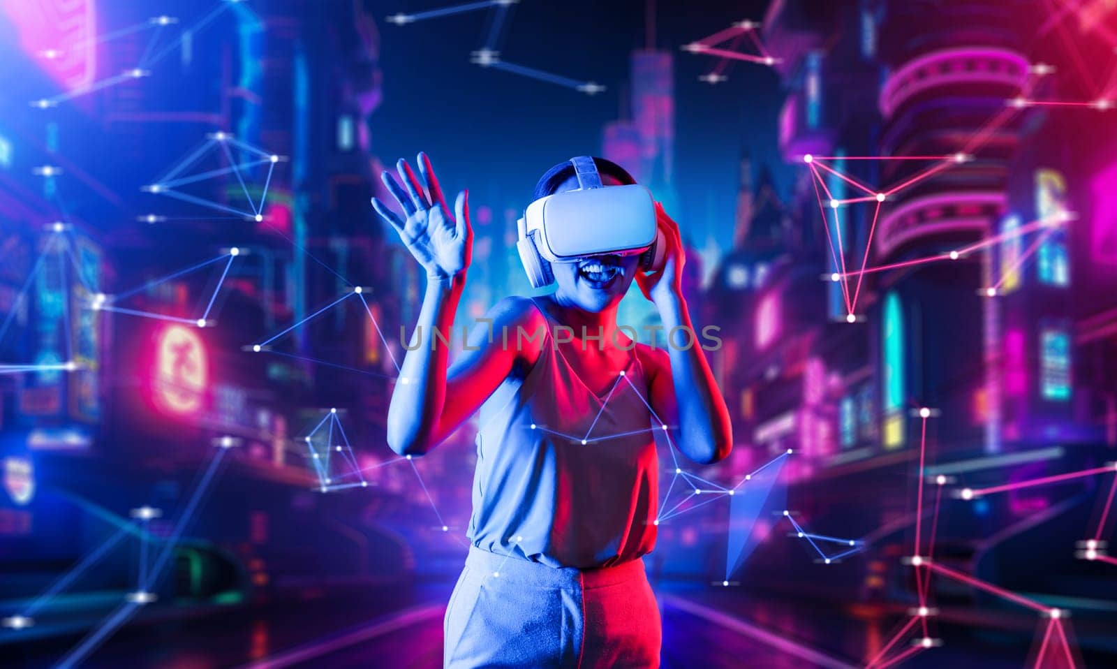 Female standing in virtual reality cyberpunk style building wear VR headset connecting metaverse, future cyberspace community technology, Woman dancing raising one arm holding goggle. Hallucination.