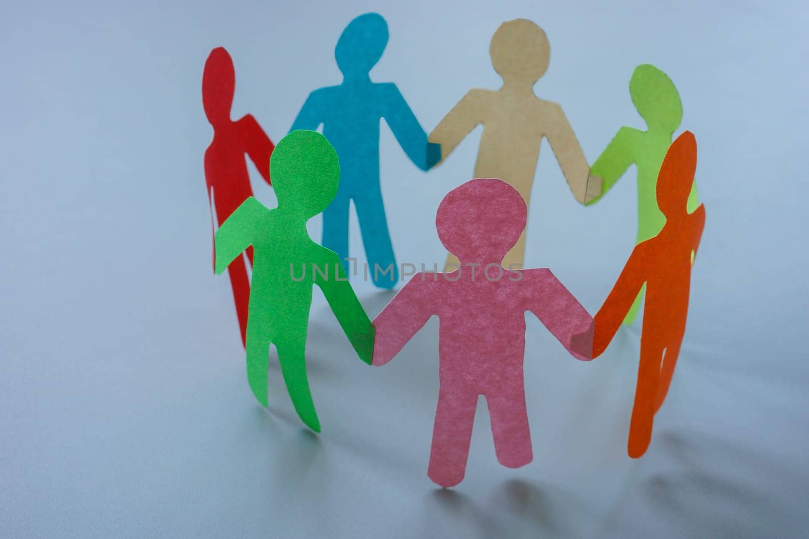 Circle of colored paper people. Concept of unity, diversity and teamwork. by designer491
