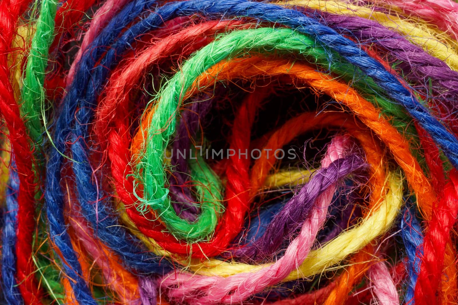 Close up of different colored threads.
