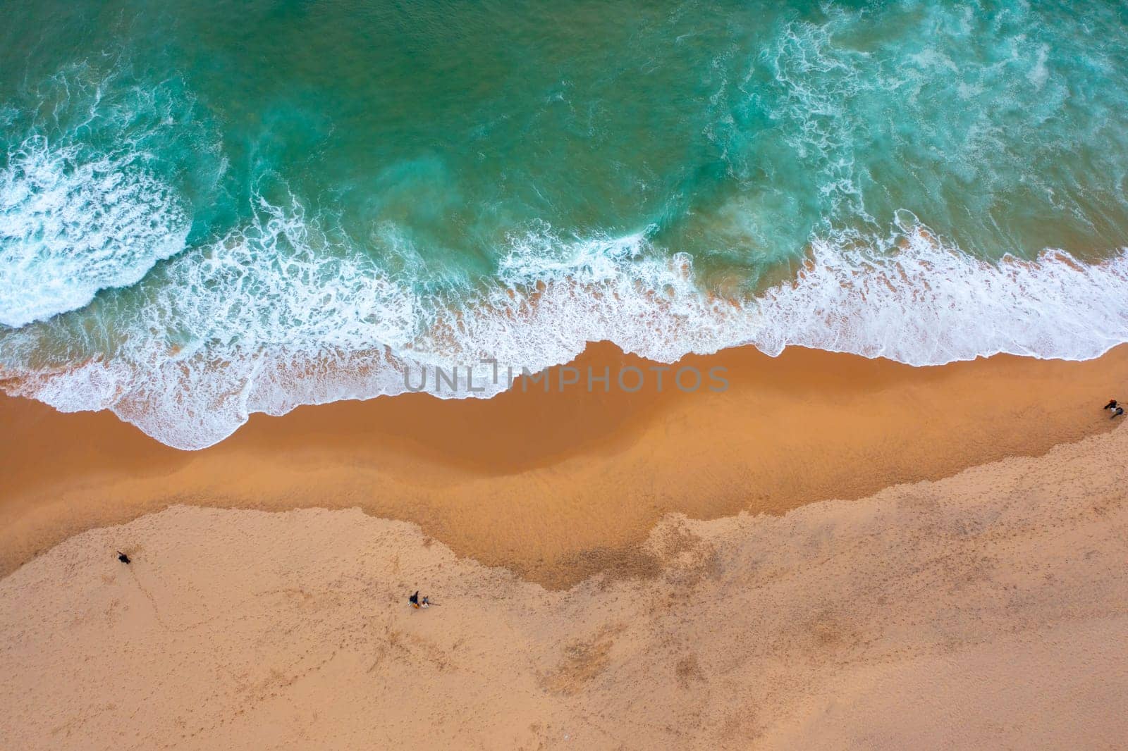 Aerial view ocean wave and sandy beach by andreonegin