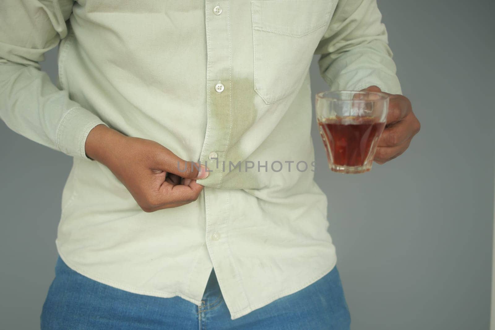 men hands with spilled water over his shirt by towfiq007