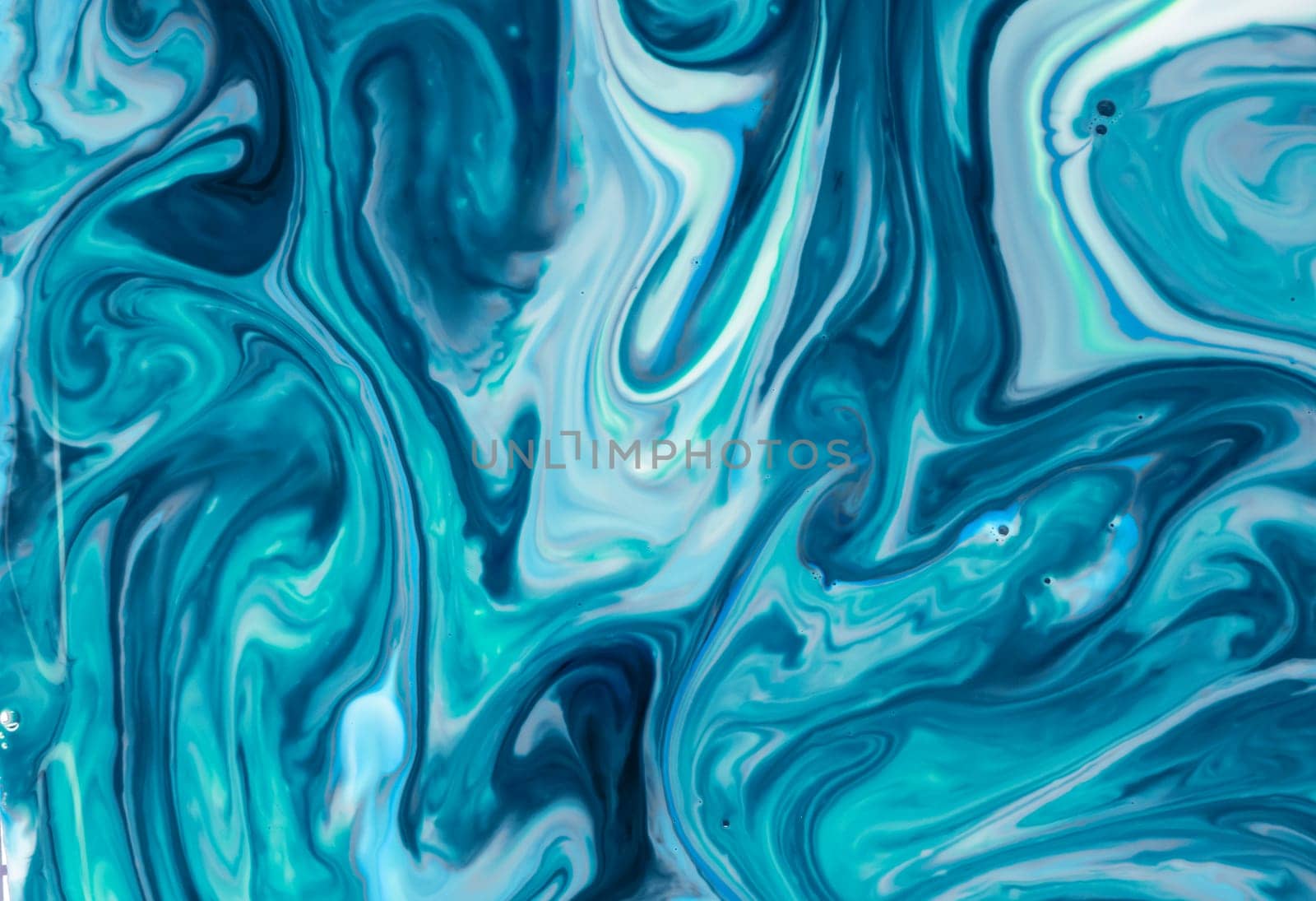 liquid paints in slow blending flow. Beautiful abstraction of liquid paints.