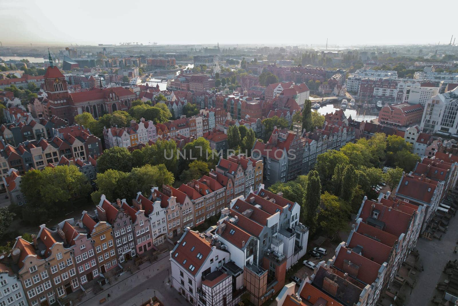 Beautiful panoramic architecture of old town in Gdansk, Poland at sunrise. Aerial view drone pov. Landscape cityscape City from Above. Small vintage historical buildings Europe Tourist Attractions travel destination in Gdansk