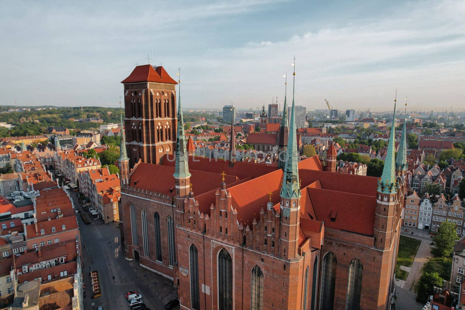 St. Mary's Basilica Beautiful panoramic architecture of old town in Gdansk, Poland at sunrise. Aerial view drone pov. Landscape cityscape City from Above. Small vintage historical buildings Europe Tourist Attractions travel destination by anna_stasiia