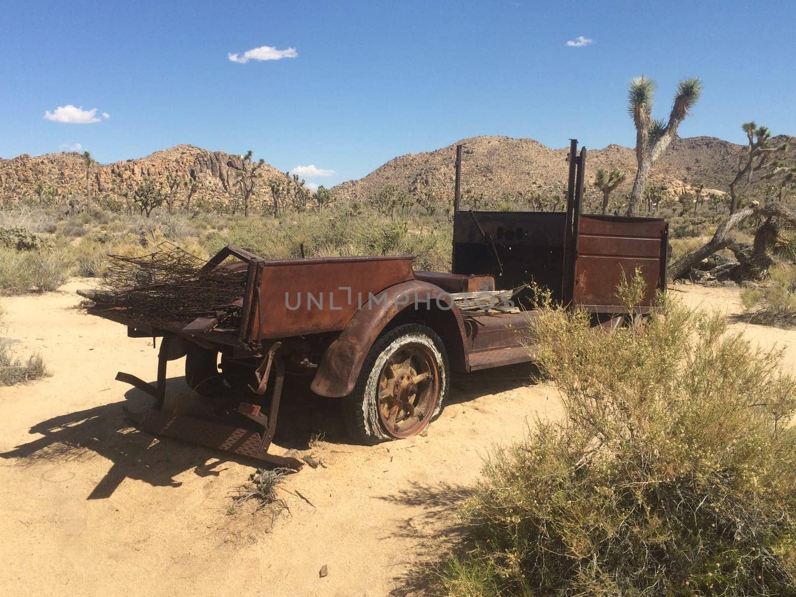 Rusty Old Car Abandoned in Near Wall Street Mill in Joshua Tree National Park . High quality photo