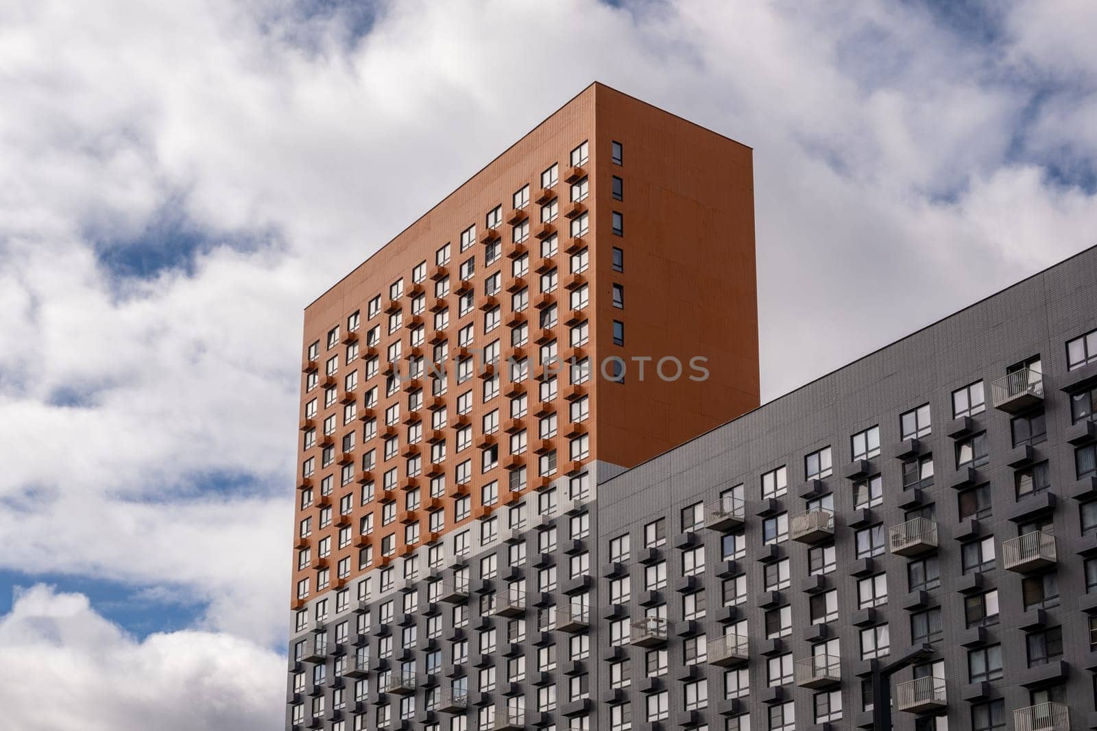 New buildings in Moscow, high-rise bright creative house and against the sky by AnatoliiFoto