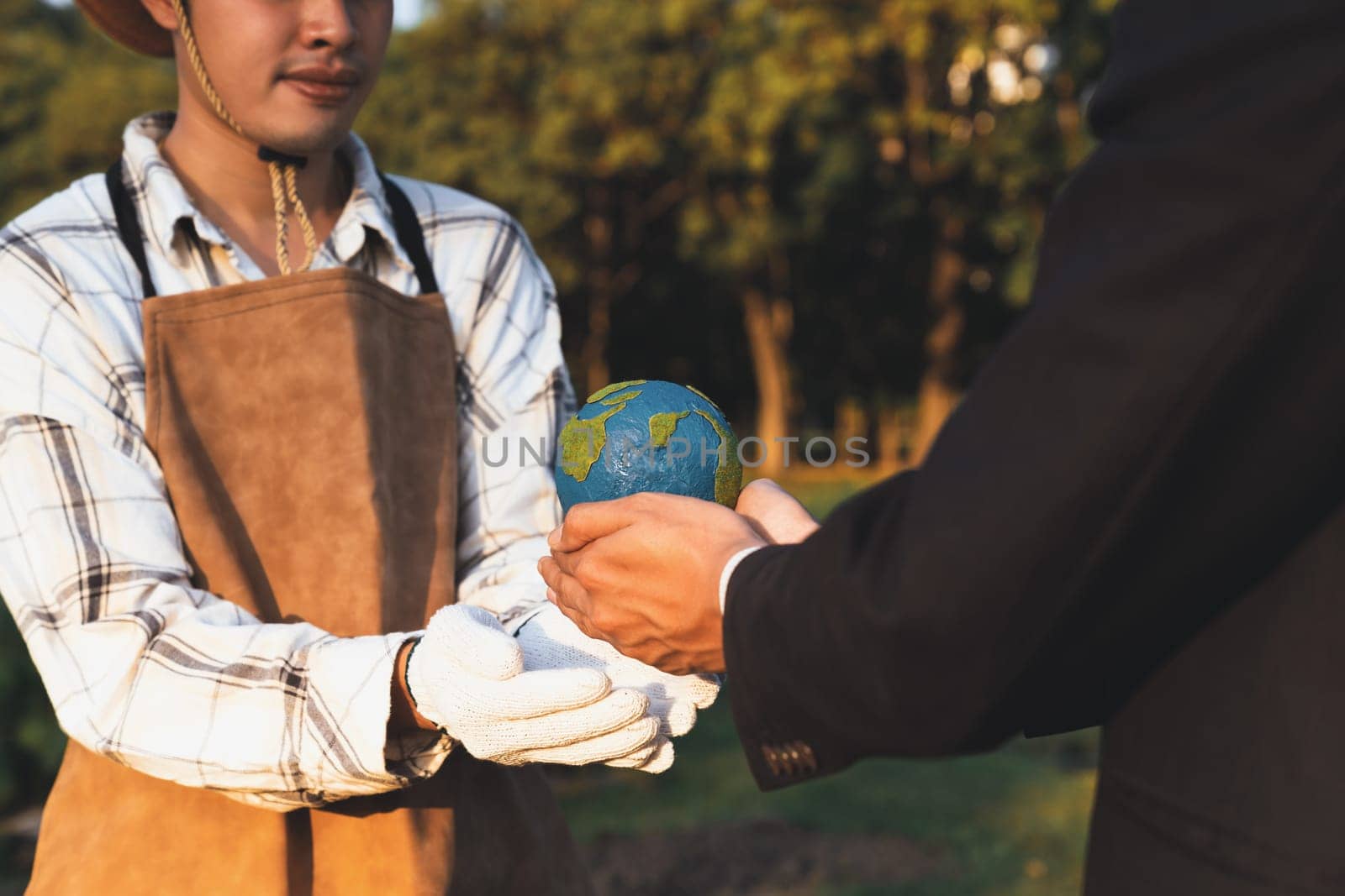 Eco-business company empower farmer with eco-friendly farming practice and clean agricultural technology. Cultivate sustainable future and holding Earth globe symbolize commitment to environment.Gyre