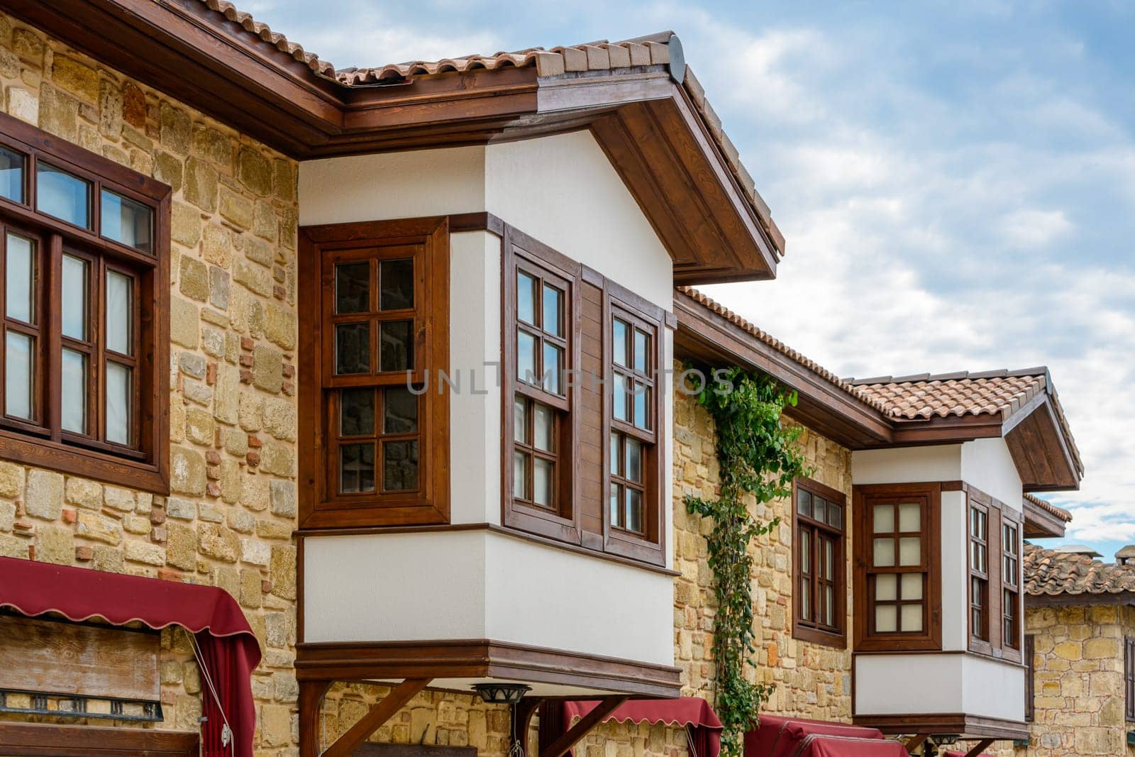 Restored houses with bay windows on the historical streets of Side Antalya