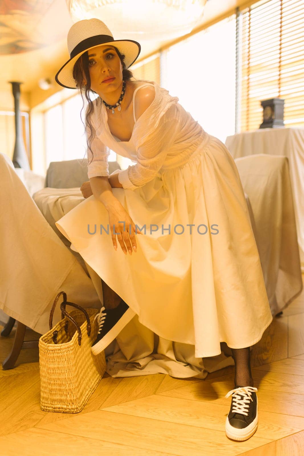 Beautiful tender woman in white dress posing. Beauty, fashion. Haircare. Cosmetics